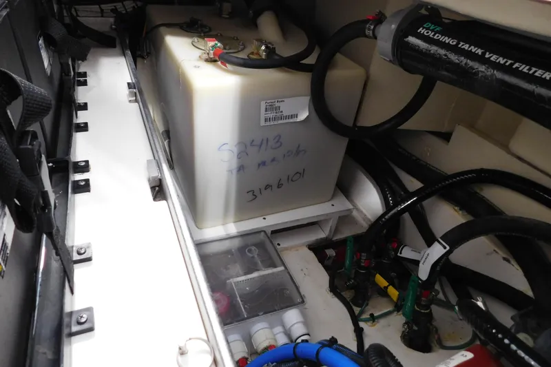 Three Point O.h. Yacht Photos Pics 2022 Pursuit S 328 Sport boat interior showing holding tank and vent filter system.