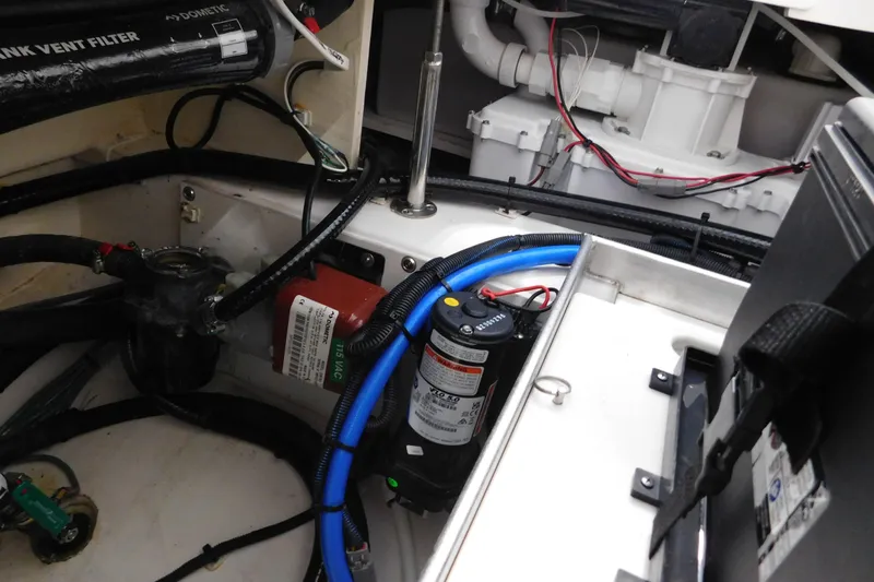 Three Point O.h. Yacht Photos Pics 2022 Pursuit S 328 Sport engine compartment with wiring and components.