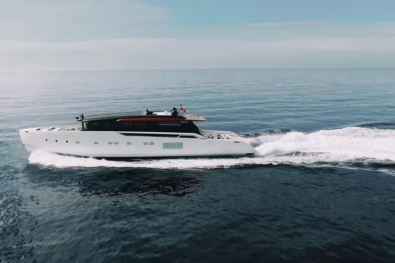 Anmax Yacht Photos Pics Luxurious 2022 Sanlorenzo SP110 yacht cruising on open sea under clear sky.