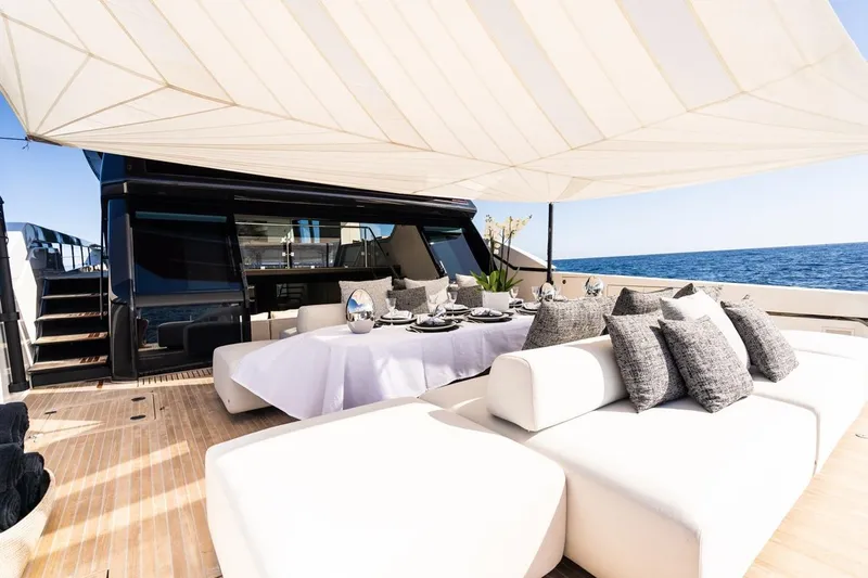 Anmax Yacht Photos Pics Luxurious 2022 Sanlorenzo SP110 yacht deck with elegant seating and ocean view.