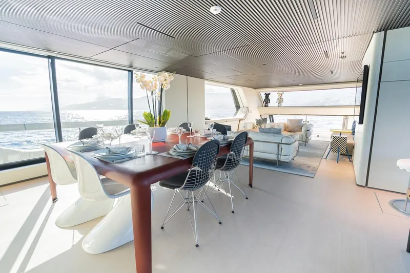 Anmax Yacht Photos Pics Luxurious interior of 2022 Sanlorenzo SP110 yacht with elegant dining and seating area.