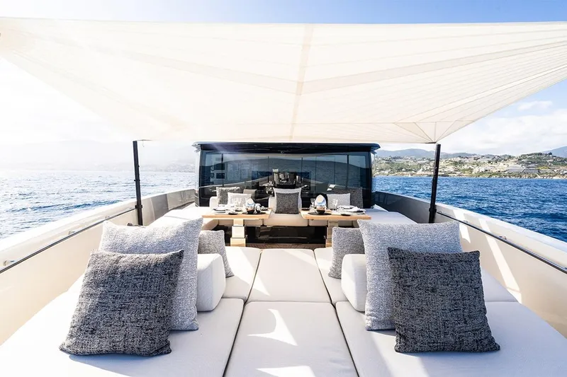Anmax Yacht Photos Pics Luxurious 2022 Sanlorenzo SP110 yacht with elegant outdoor seating and ocean view.