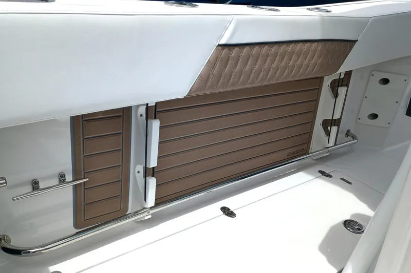  Yacht Photos Pics 2025 Blackfin 272 CC boat interior with sleek, modern design and wood accents.