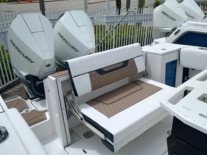  Yacht Photos Pics 2025 Blackfin 272 CC boat with dual Mercury engines and foldable seating.