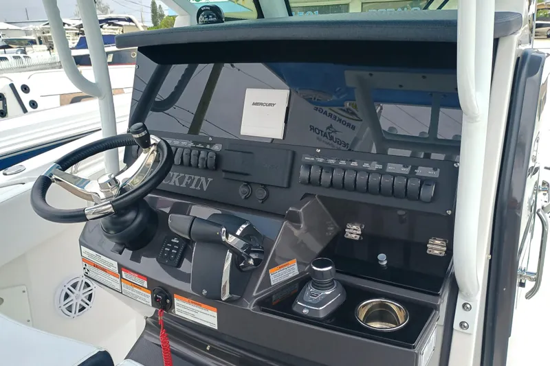  Yacht Photos Pics 2025 Blackfin 272 CC boat dashboard with steering wheel and controls.
