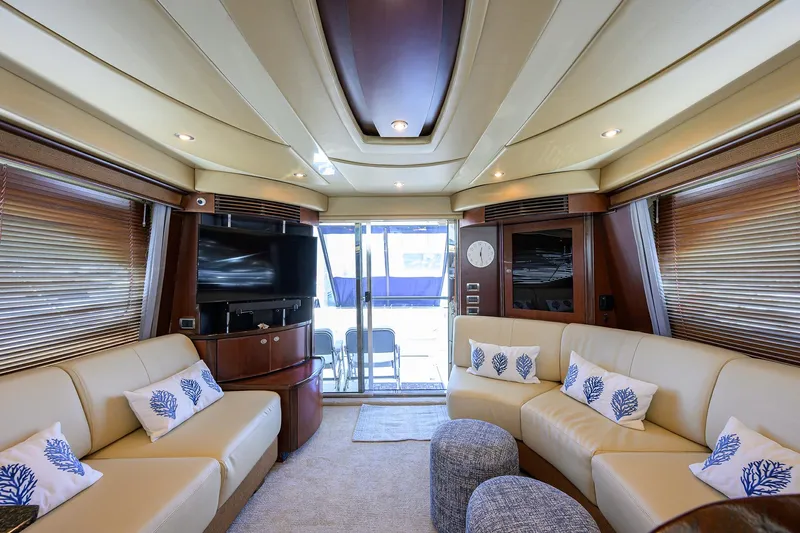 Yes Dear Yacht Photos Pics Luxurious interior of 2005 Sea Ray 52 Sedan Bridge yacht with plush seating and modern decor.
