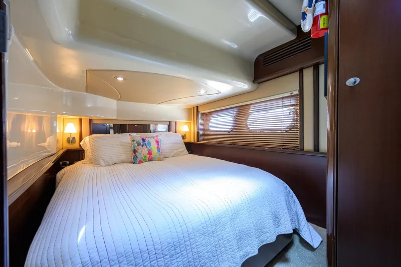 Yes Dear Yacht Photos Pics Luxurious bedroom interior of 2005 Sea Ray 52 Sedan Bridge yacht with cozy bedding.
