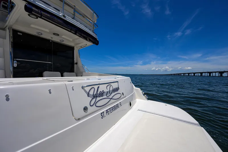 Yes Dear Yacht Photos Pics 2005 Sea Ray 52 Sedan Bridge yacht on water, clear sky, bridge in background.