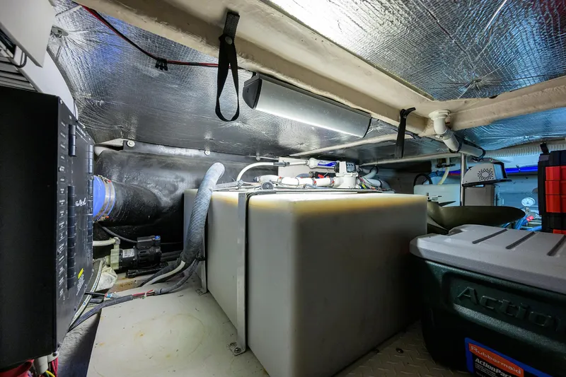 Yes Dear Yacht Photos Pics Engine room of a 2005 Sea Ray 52 Sedan Bridge, featuring storage and mechanical components.