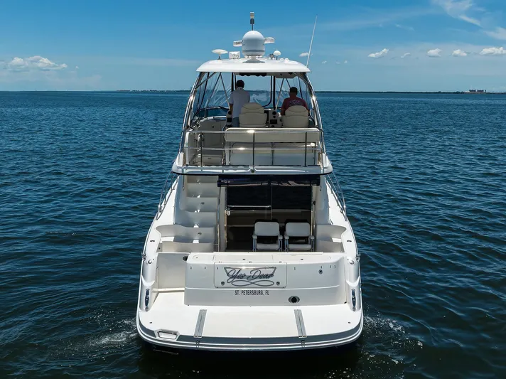 Yes Dear Yacht Photos Pics 2005 Sea Ray 52 Sedan Bridge yacht cruising on open water.