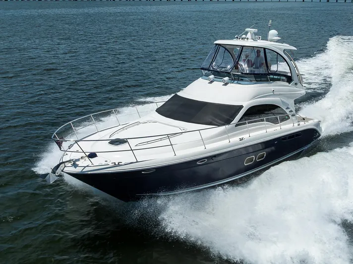 Yes Dear Yacht Photos Pics 2005 Sea Ray 52 Sedan Bridge yacht cruising on open water.