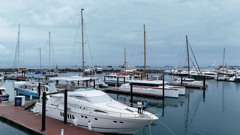  Yacht Photos Pics Marina with 2008 Fairline Squadron 74 yacht docked, surrounded by various boats under cloudy skies.