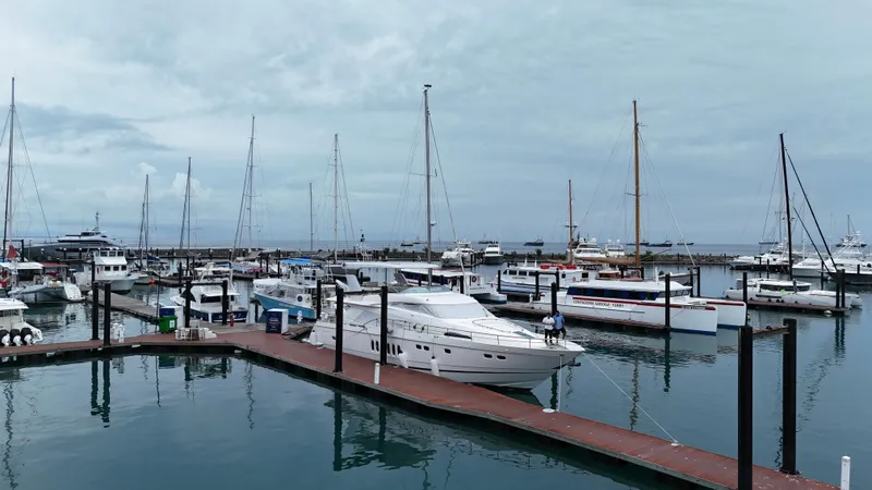  Yacht Photos Pics Marina with 2008 Fairline Squadron 74 yacht docked among various boats under cloudy skies.
