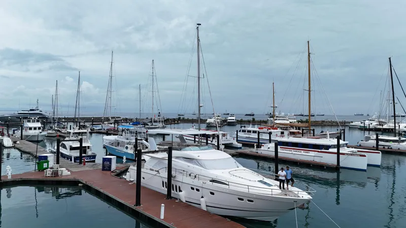  Yacht Photos Pics Luxury yacht Fairline Squadron 74, 2008 model, docked in a bustling marina.