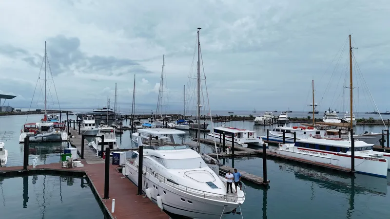  Yacht Photos Pics Marina with 2008 Fairline Squadron 74 yacht docked, surrounded by various boats under cloudy skies.