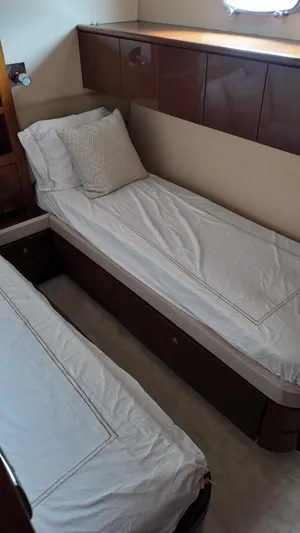  Yacht Photos Pics Twin cabin interior of 2008 Fairline Squadron 74 yacht with elegant wood finish.