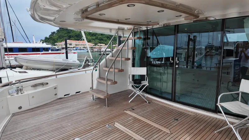  Yacht Photos Pics Luxury yacht deck of 2008 Fairline Squadron 74 with wooden flooring and spiral staircase.