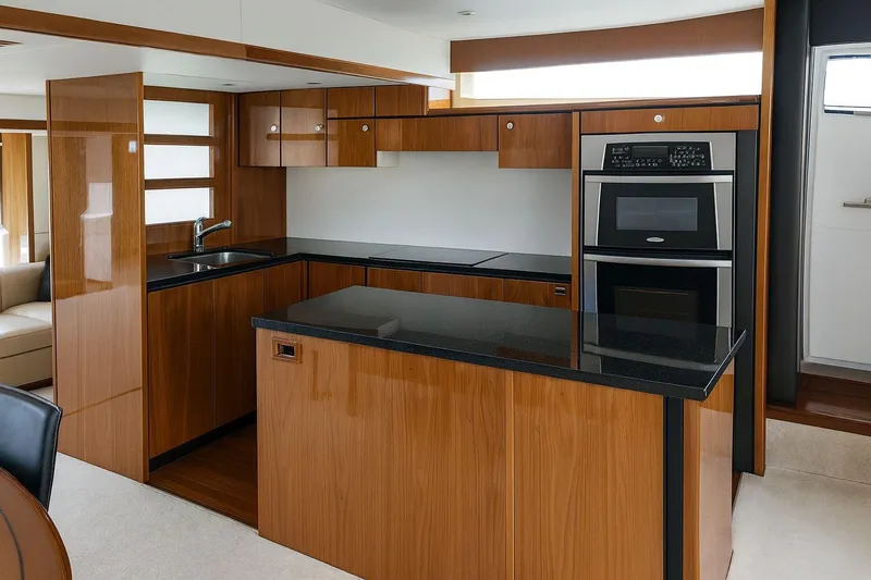  Yacht Photos Pics Luxurious kitchen interior of 2008 Fairline Squadron 74 yacht with modern appliances.