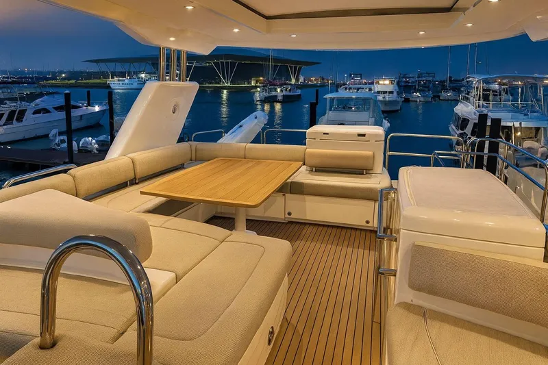  Yacht Photos Pics Luxurious 2008 Fairline Squadron 74 yacht interior with elegant seating and wooden table at marina.
