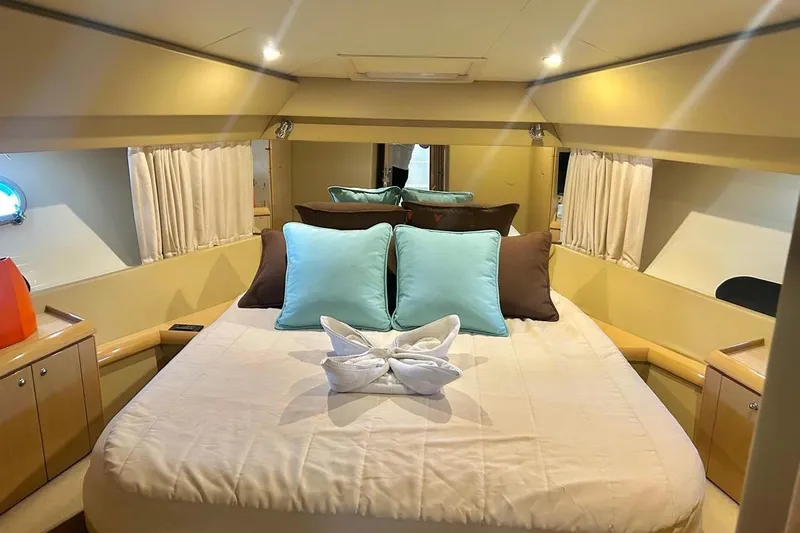  Yacht Photos Pics Luxurious cabin interior of 2008 Fairline Squadron 74 yacht with elegant bedding.