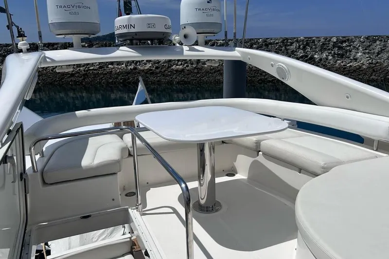  Yacht Photos Pics Luxurious 2008 Fairline Squadron 74 yacht deck with seating and table, featuring Garmin and TracVision equipment.