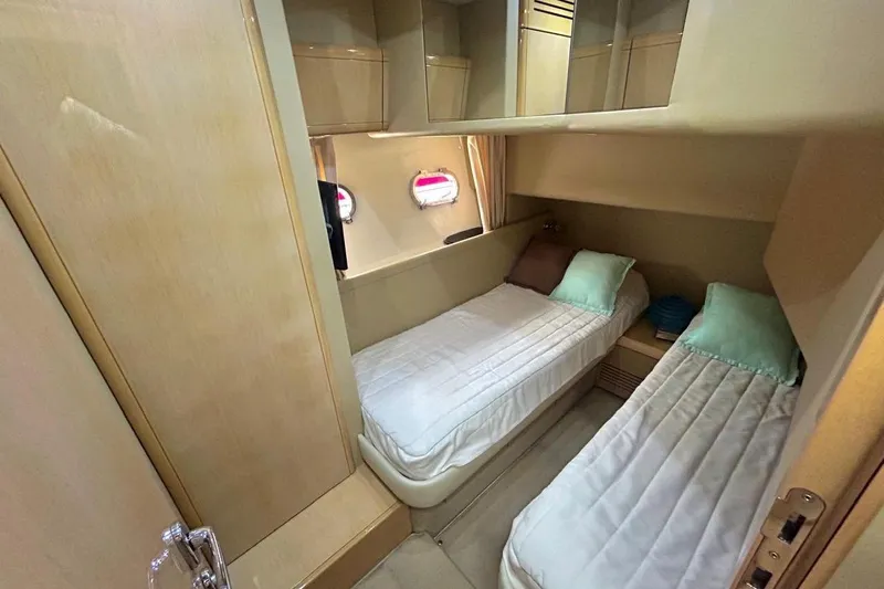  Yacht Photos Pics 2008 Fairline Squadron 74 cabin with twin beds and storage compartments.
