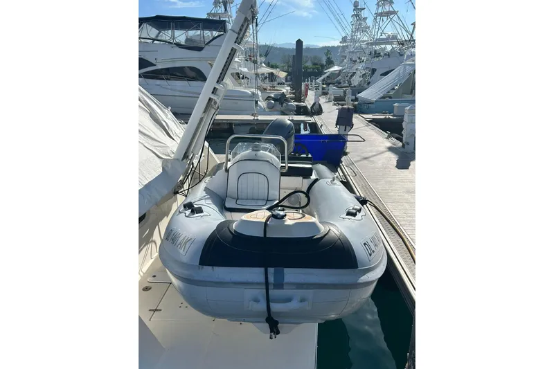  Yacht Photos Pics 2008 Fairline Squadron 74 yacht with inflatable tender docked at marina.