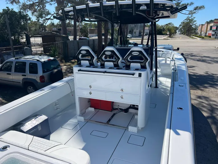  Yacht Photos Pics 2025 Contender 35 ST boat with sleek design and modern seating arrangement.