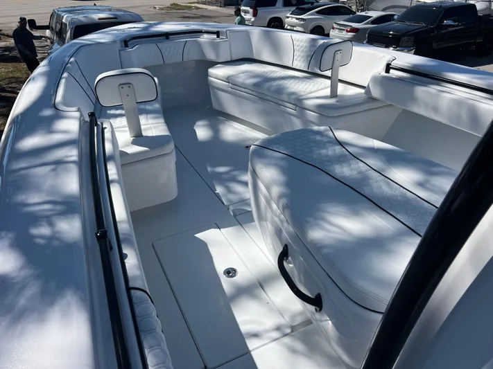  Yacht Photos Pics 2025 Contender 35 ST boat interior with white seating and sleek design.