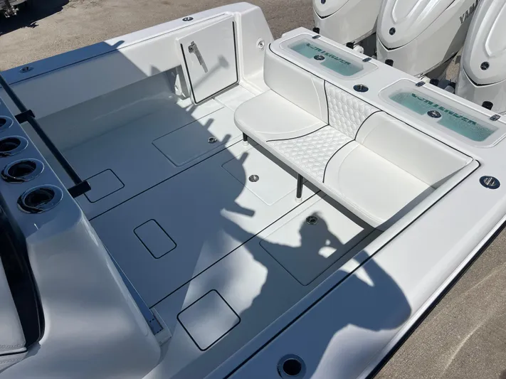  Yacht Photos Pics 2025 Contender 35 ST boat interior with white seating and storage compartments.