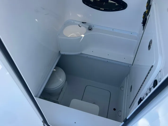  Yacht Photos Pics 2025 Contender 35 ST boat interior bathroom with sink and toilet.