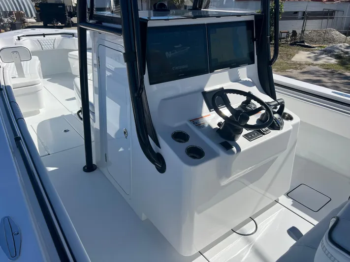  Yacht Photos Pics 2025 Contender 35 ST boat console with dual screens and steering wheel.