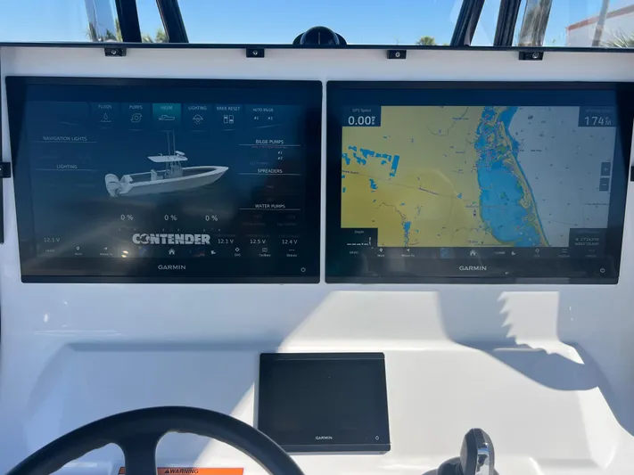  Yacht Photos Pics 2025 Contender 35 ST boat dashboard with dual Garmin navigation screens.