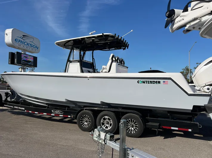  Yacht Photos Pics 2025 Contender 35 ST boat on trailer, displayed outdoors under clear blue sky.