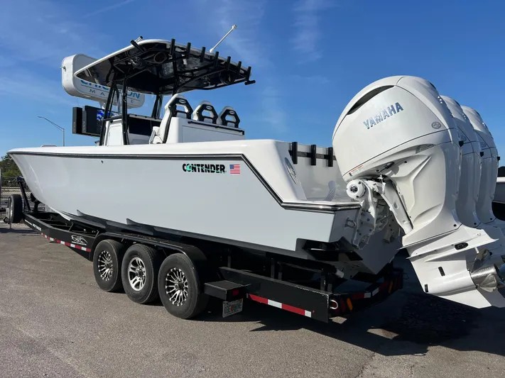  Yacht Photos Pics 2025 Contender 35 ST boat on trailer with Yamaha engines, parked outdoors.