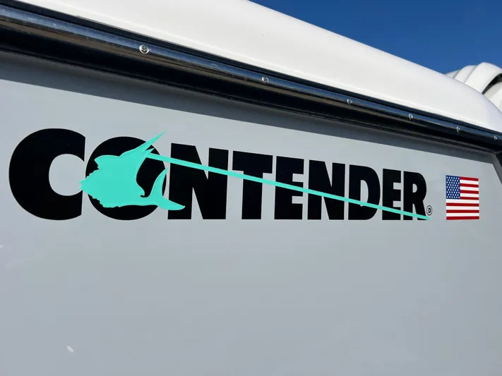  Yacht Photos Pics 2025 Contender 35 ST logo with marlin and American flag on boat exterior.