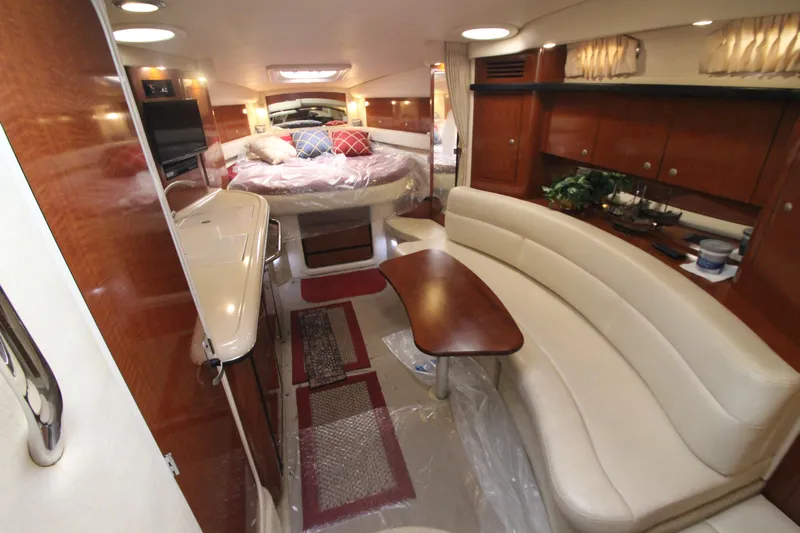  Yacht Photos Pics Luxurious interior of a 2005 Sea Ray 340 Sundancer yacht with elegant seating and wood finishes.