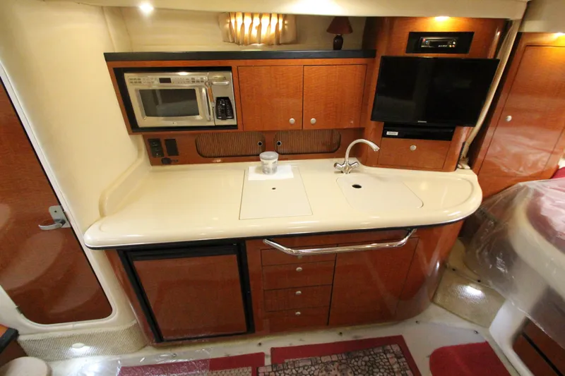  Yacht Photos Pics 2005 Sea Ray 340 Sundancer galley with microwave, sink, and TV.
