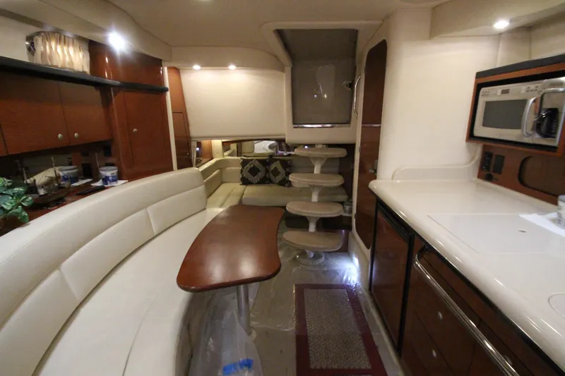  Yacht Photos Pics Interior of 2005 Sea Ray 340 Sundancer yacht with modern kitchen and seating area.