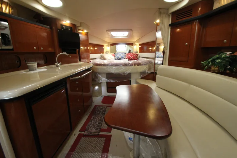  Yacht Photos Pics Luxurious interior of 2005 Sea Ray 340 Sundancer yacht with elegant wood finishes.