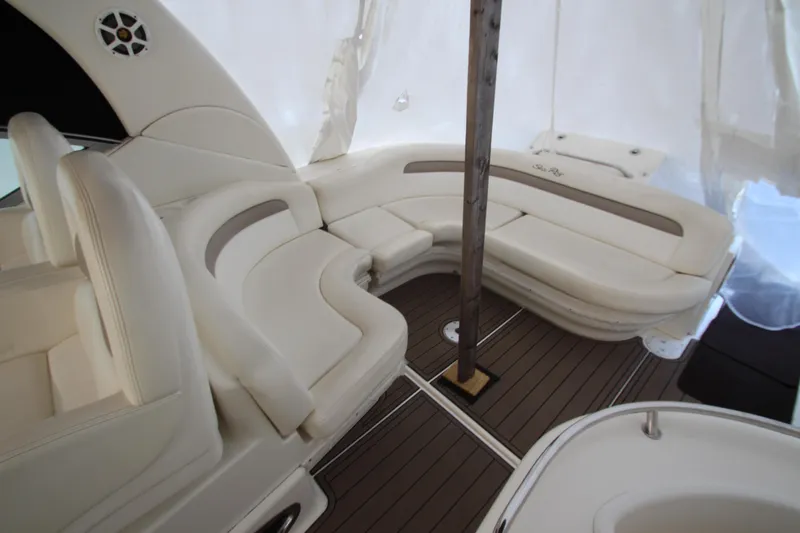  Yacht Photos Pics 2005 Sea Ray 340 Sundancer interior with white seating and wood flooring.