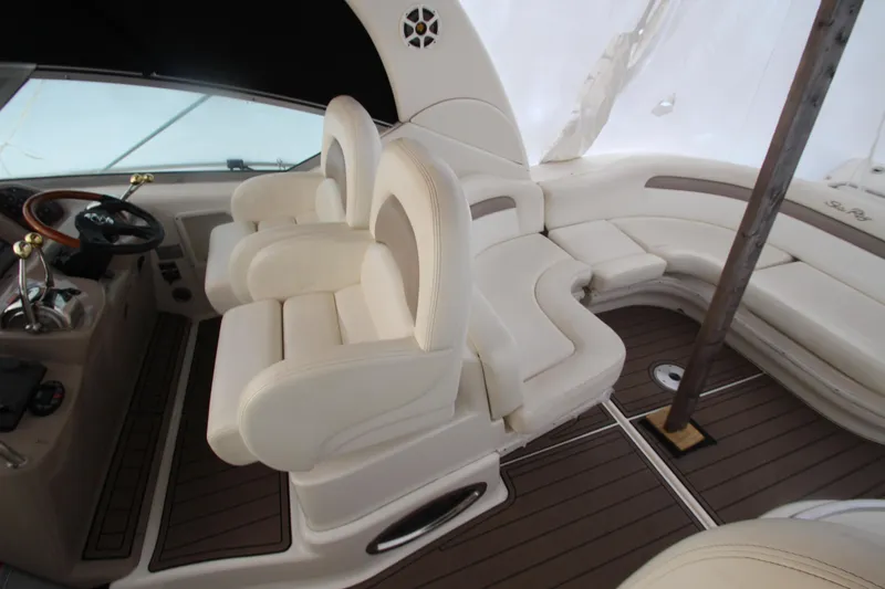  Yacht Photos Pics Luxurious interior of 2005 Sea Ray 340 Sundancer with plush seating and elegant design.