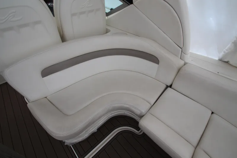  Yacht Photos Pics 2005 Sea Ray 340 Sundancer interior seating with white upholstery and curved design.