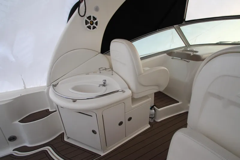  Yacht Photos Pics 2005 Sea Ray 340 Sundancer interior with helm seat and sink, featuring sleek design.