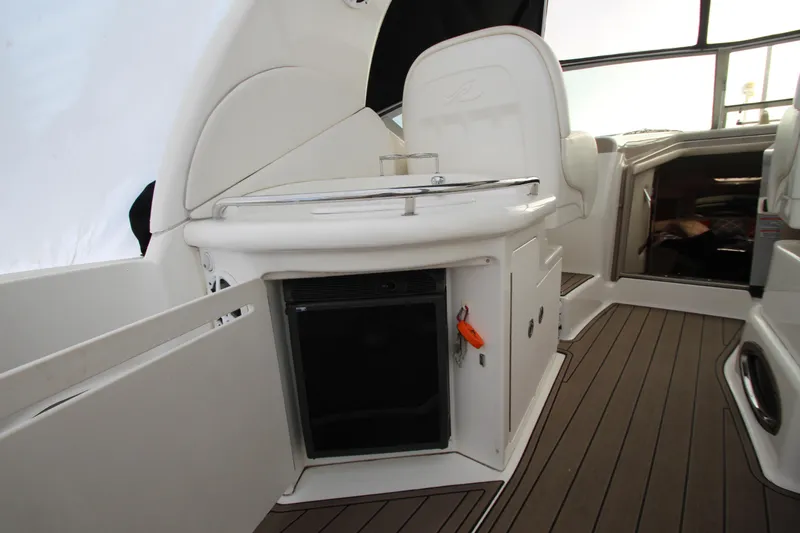  Yacht Photos Pics 2005 Sea Ray 340 Sundancer interior with kitchenette and seating area.