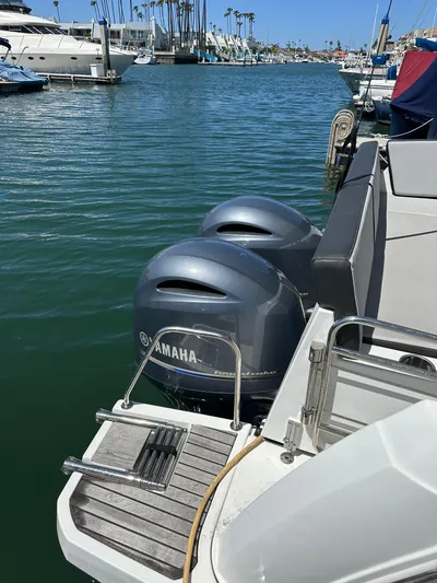 Destination Unknown II Yacht Photos Pics 2021 Jeanneau NC 895 with Yamaha outboard engines docked in a marina.