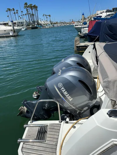 Destination Unknown II Yacht Photos Pics Jeanneau NC 895 boat with Yamaha outboard motors docked in a marina.