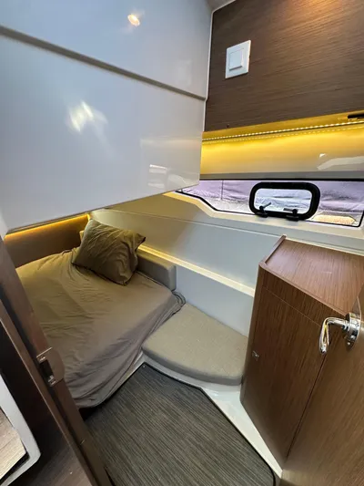 Destination Unknown II Yacht Photos Pics Interior cabin of 2021 Jeanneau NC 895 with cozy bed and modern design.