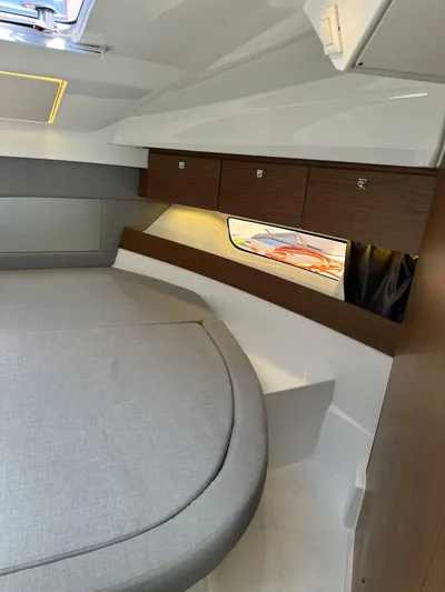 Destination Unknown II Yacht Photos Pics Interior of 2021 Jeanneau NC 895 boat with modern design and cozy sleeping area.