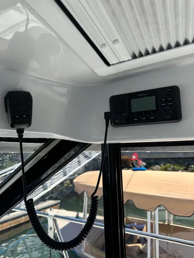 Destination Unknown II Yacht Photos Pics Interior view of 2021 Jeanneau NC 895 boat with communication equipment.